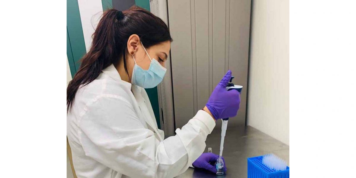 undergraduate researcher pipets liquid